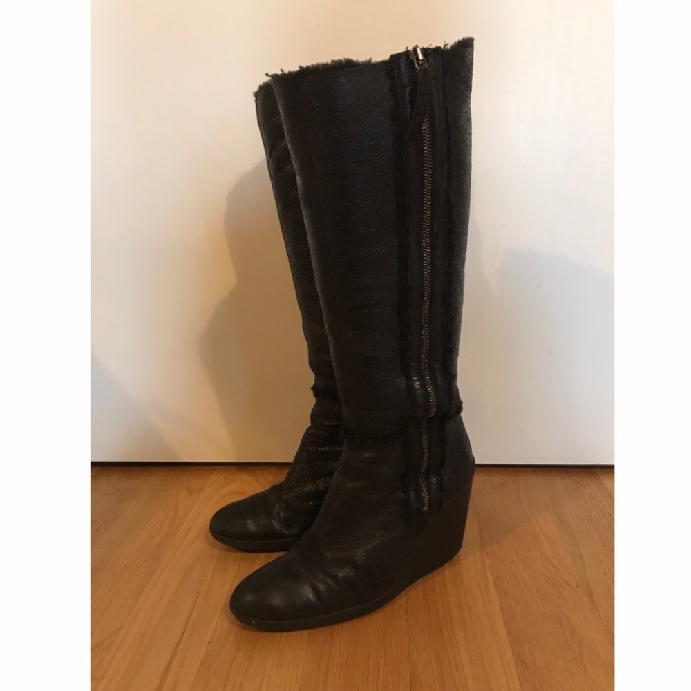 PRADA Black leather platform boots with shearling